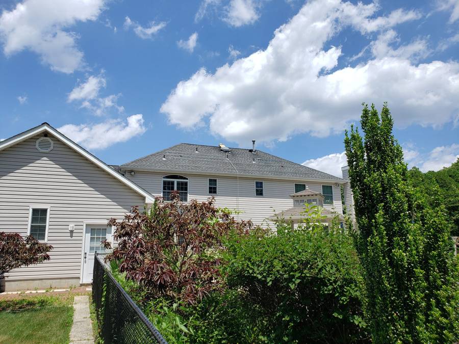 Two-story home with solar panels on the roof